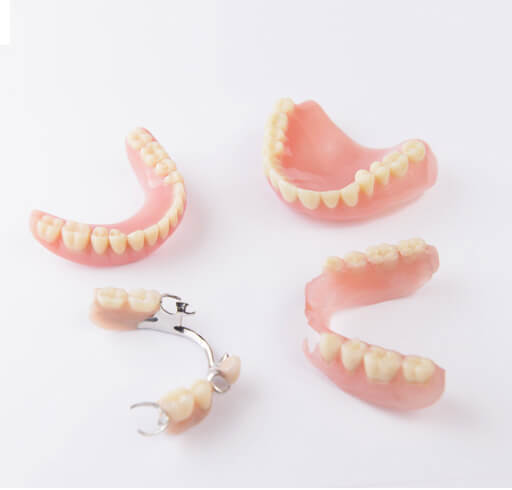 Different types of dentures including complete and partial dentures