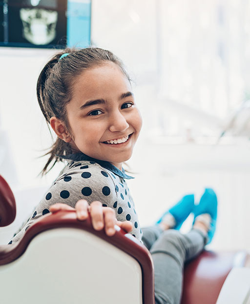 Dental patient receiving guidance on caring for porcelain veneers