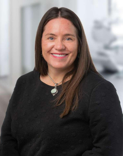 Amy, dental professional at Salt Lake City practice, smiling in portrait.